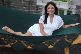 Bethenney Frankel, white lace dress, hammock, beige high heels, turquoise earrings